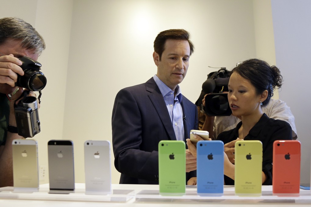 Apple’s low-cost phone comes in blue, white, pink, yellow and green, and the top-line model in silver, gold and a new “space gray.” Photo: AP