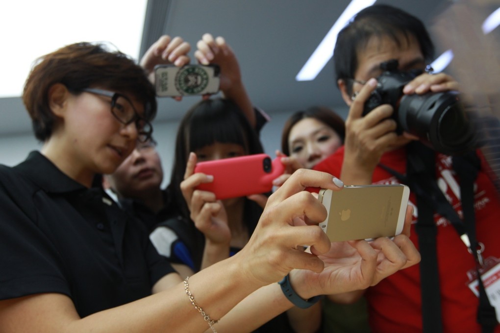 Photographers at Apple's first press event in Beijing. Photo: Simon Song