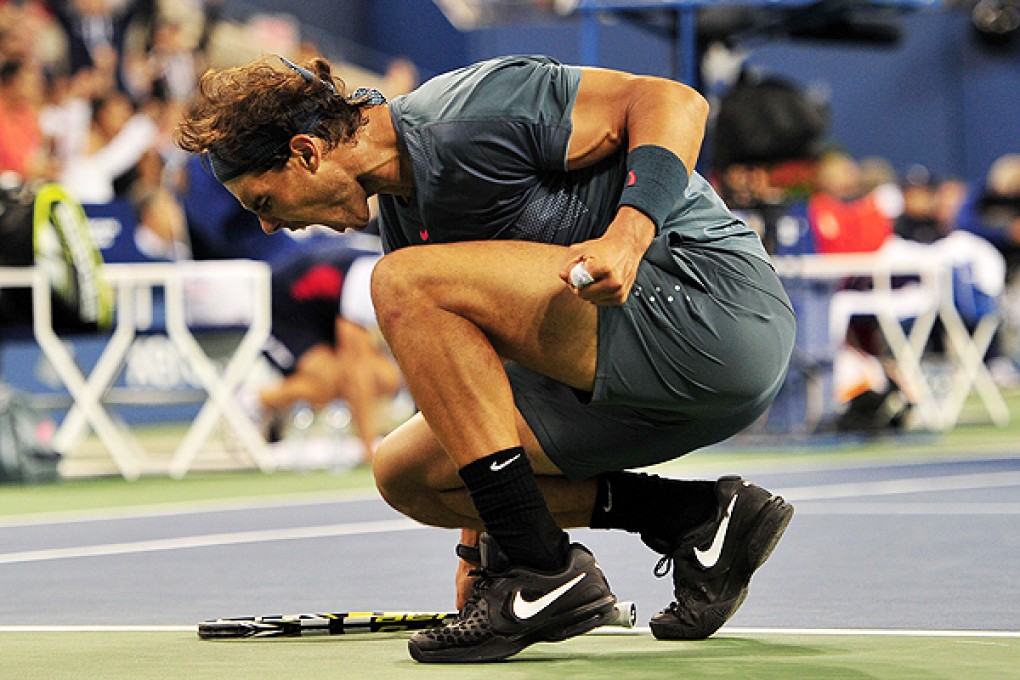 Rafael Nadal  reacts after winning the third set against Novak Djokovic at the US Open in New York. Photo: AFP