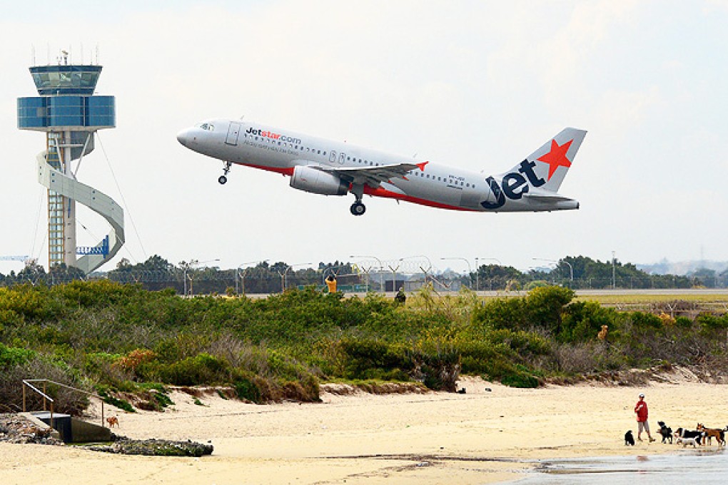 A Jetstar aircraft takes off in Sydney, where critics of plans for the Hong Kong start-up say management control will rest. Photo: Bloomberg