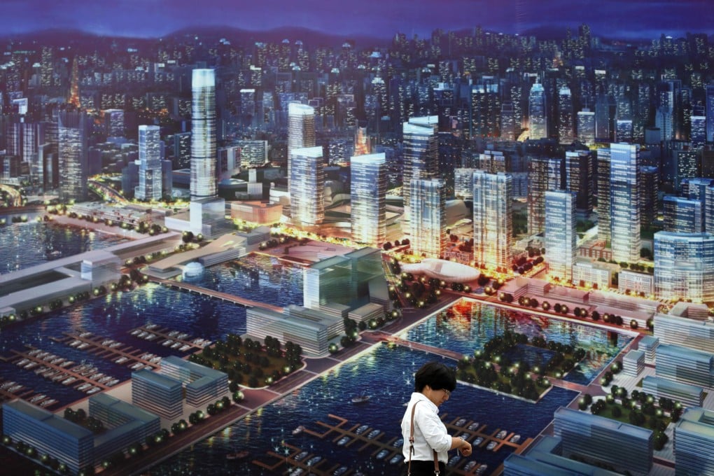 A property firm advert near the World Economic Forum meeting in Dalian, at which China may focus on social tensions. Photo: Bloomberg