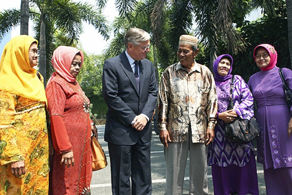 Dutch Ambassador for Indonesia Tjeerd de Zwaan (centre) meets surviving family members of victims of mass killings committed by the Dutch military between 1945-1949 after a ceremony in Jakarta, Indonesia, on Thursday. Photo: AP
