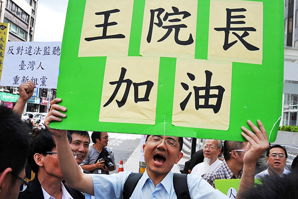Supporters of Taiwan's Legislative Speaker Wang Jin-pyng gather outside the KMT headquarters in Taipei yesterday. Photo: AFP