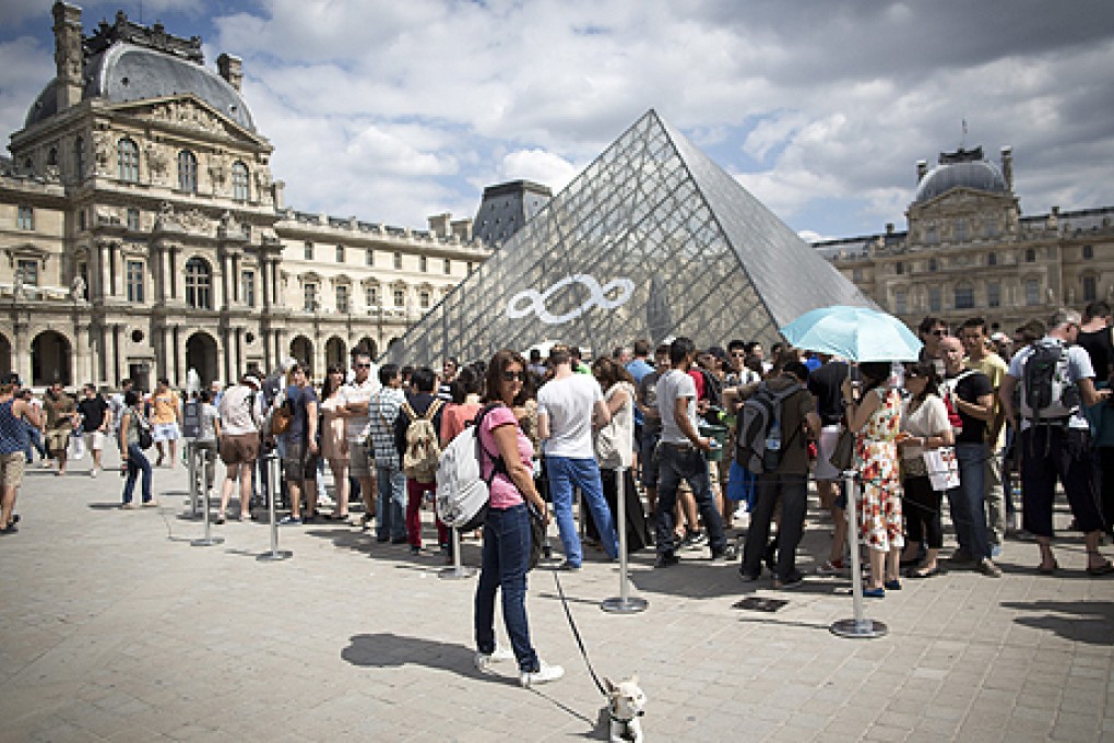 The Louvre, which had 10 million visitors last year, draws the highest number of daily visits to a Paris museum, including many mainland tourists. Photo: EPA