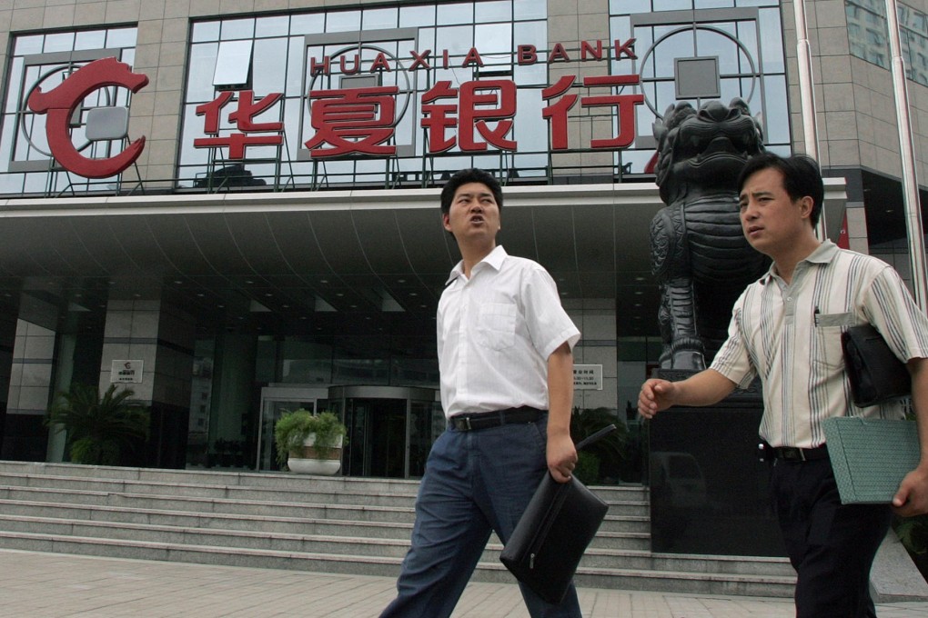 With the memory of the collapse of Lehman Brothers in 2008 still fresh, the growth of thinly regulated shadow banking activity in China, such as the sale of a wealth management product by a branch of Huaxia Bank, has been a cause of concern for investors. Photo: Bloomberg