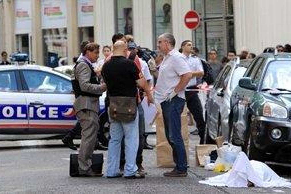 Officers take statements at the scene of the shooting in Nice