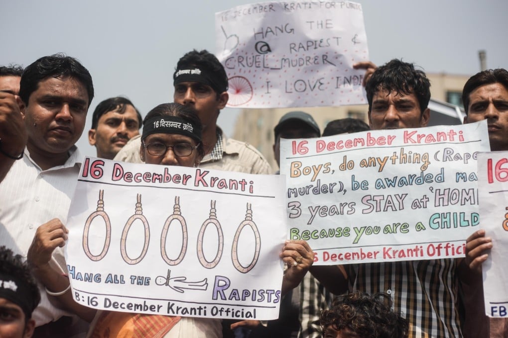 Indians hold banners during a demonstration demanding death penalty for all four rapists convicted in the horrific Delhi gang rape, in New Delhi. Photo: Xinhua