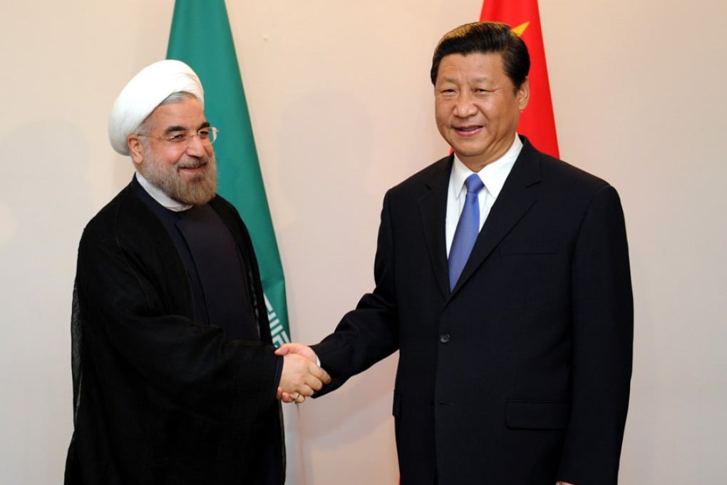 Xi Jinping (right) shakes hands with Iranian president Hassan Rouhani. Photo: Xinhua