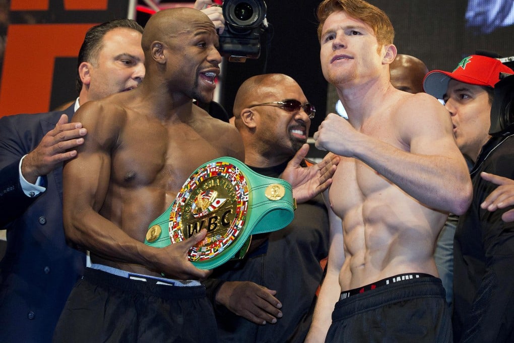 Floyd Mayweather Jnr (left) with Canelo Alvarez. Photo: AP