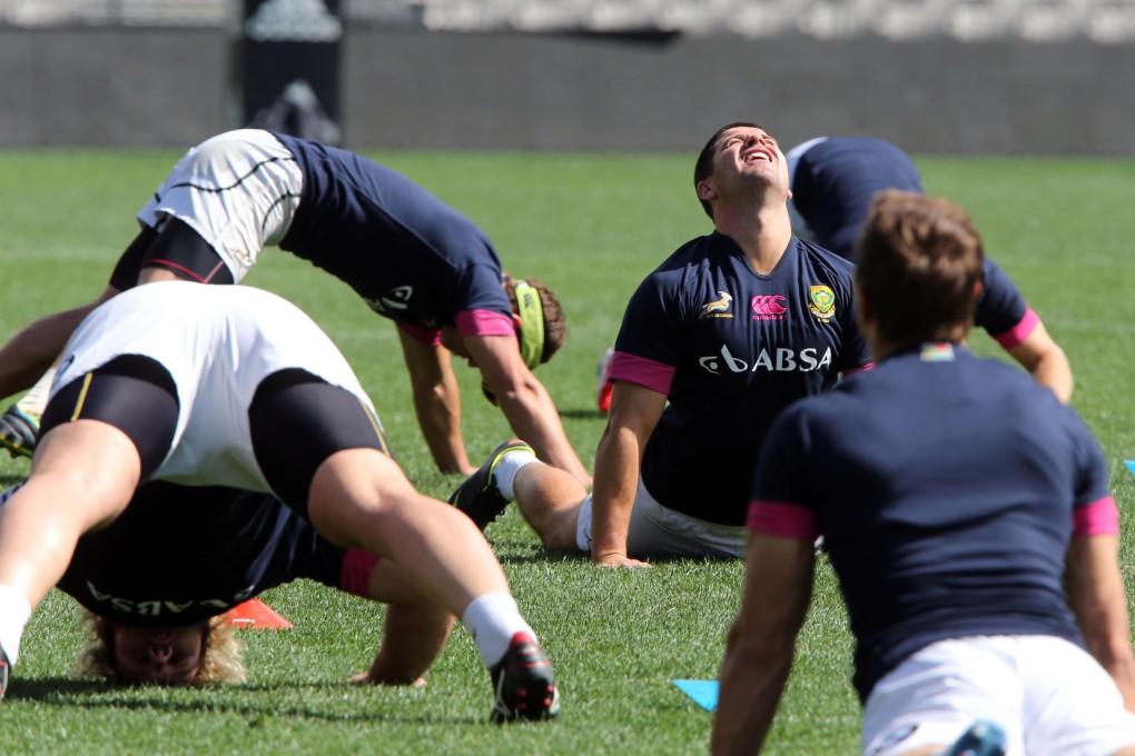 South Africa warm up as they train for today's clash with New Zealand, in a match between the world's top two sides. Photo: AFP