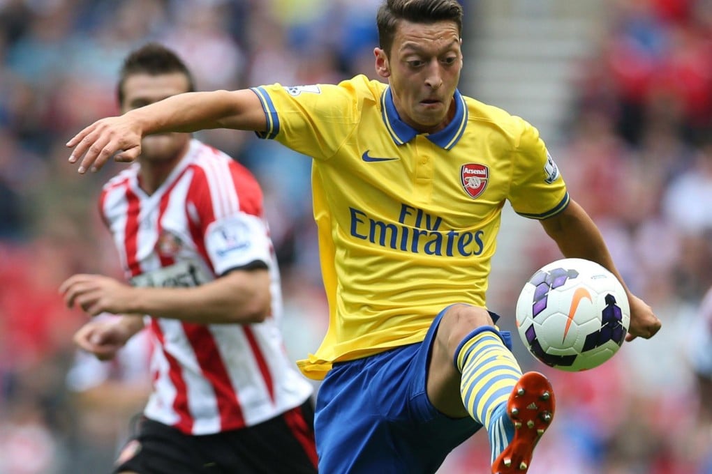 Arsenal's new signing Mesut Ozil controls the ball on his way to setting up his side's first goal in the 3-1 win against Sunderland. Photo: AFP