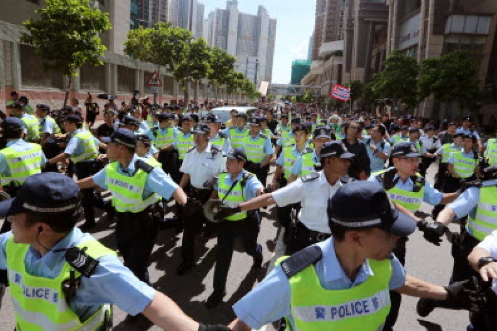 Hong Kong police on duty. Three police associations walked out of the Pay Trend Survey Committee in June to protest against the comittee's suggested pay rise. Photo: Felix Wong