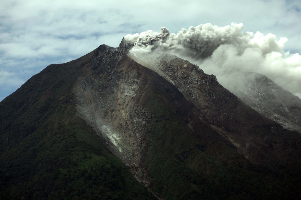 Mount Sinabung spews hot gas and ashes during an eruption. Photo: EPA