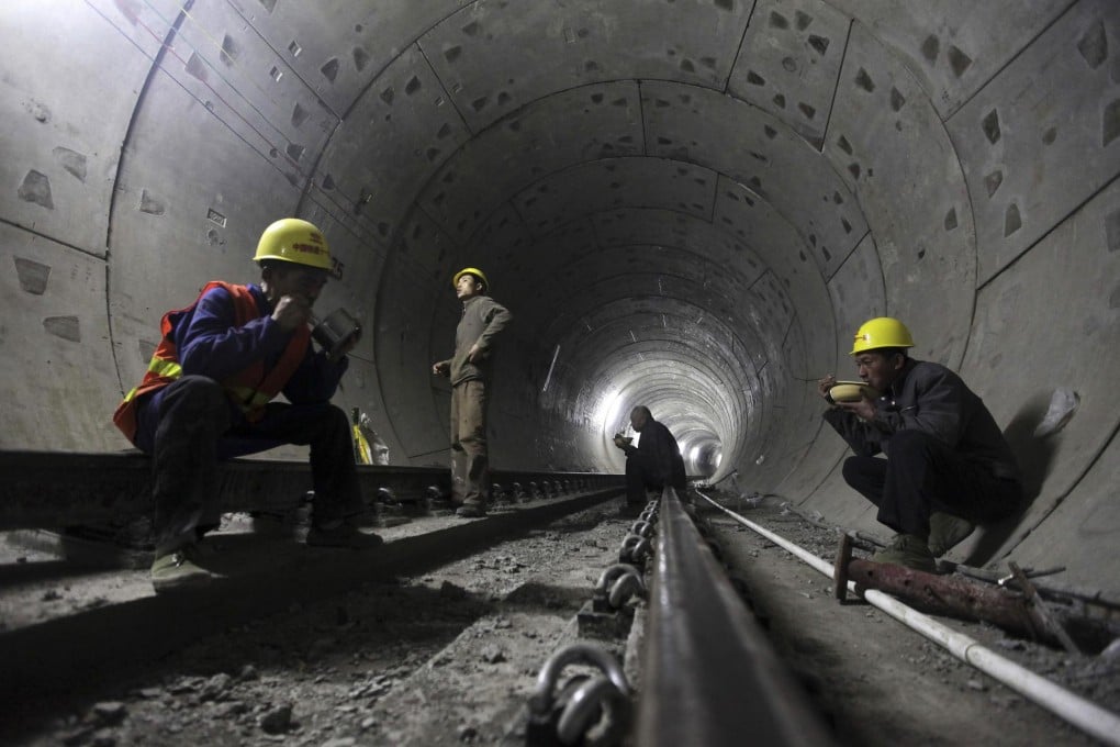 Labourers take a meal break inside a new subway tunnel under construction in Wuhan, Hubei province. Photo: Reuters
