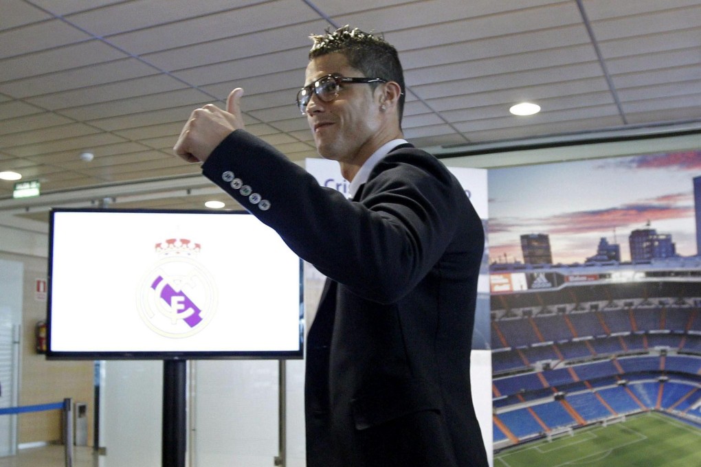 Cristiano Ronaldo looked pleased with his new deal. Photo: EPA