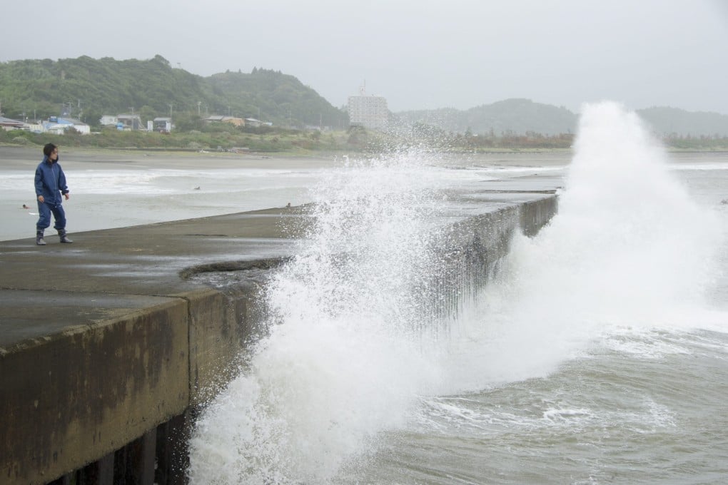 High waves beat against a pier at Taito port, 80 kilometres east of Tokyo in Isumi city, Chiba prefecture, Japan. Photo: EPA