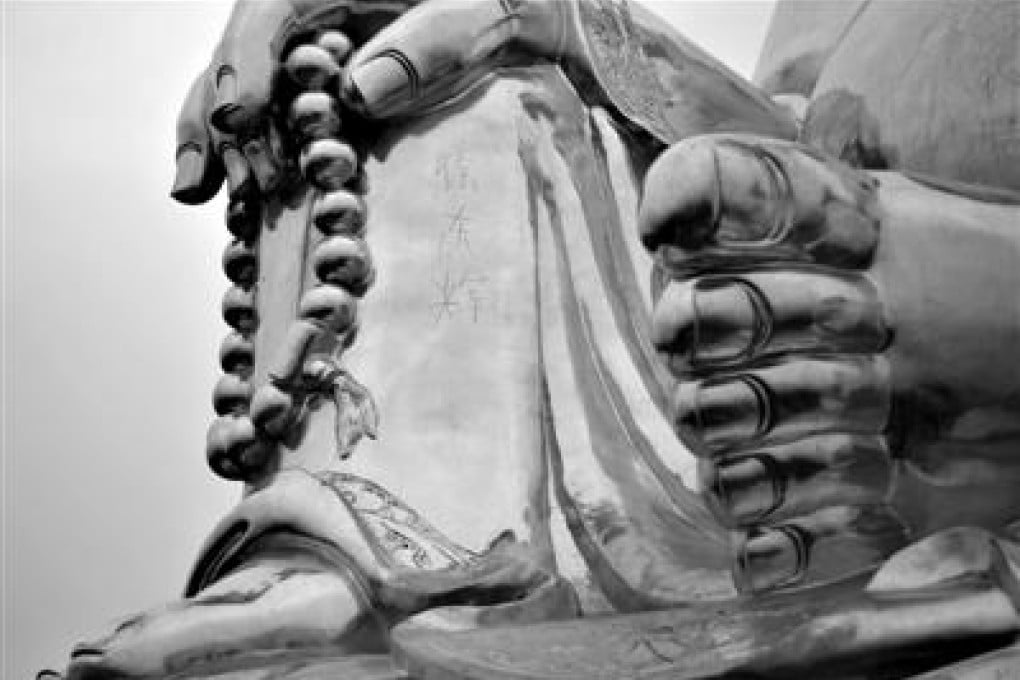 Chinese characters "Xu Donghui" are carved on the Buddha statue in Beijing. Photo: Xinhua