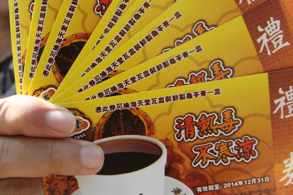 The Democratic Party demands action at the Consumer Council, North Point yesterday. Photo: Felix Wong