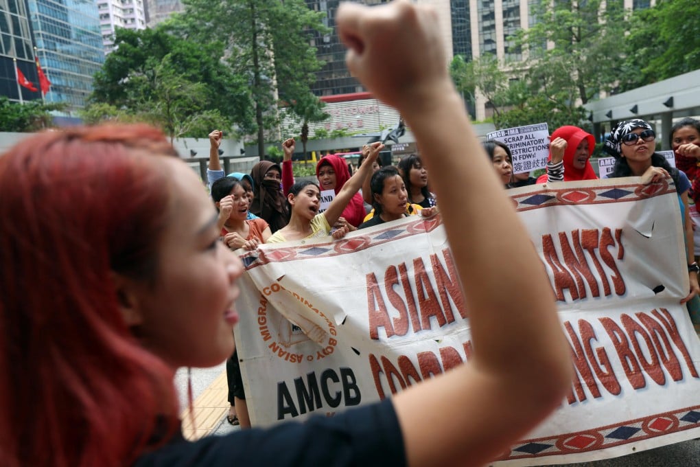 Supporters of Kartika Puspitasari cheer outside the court as her ex-bosses are jailed. Photo: Sam Tsang