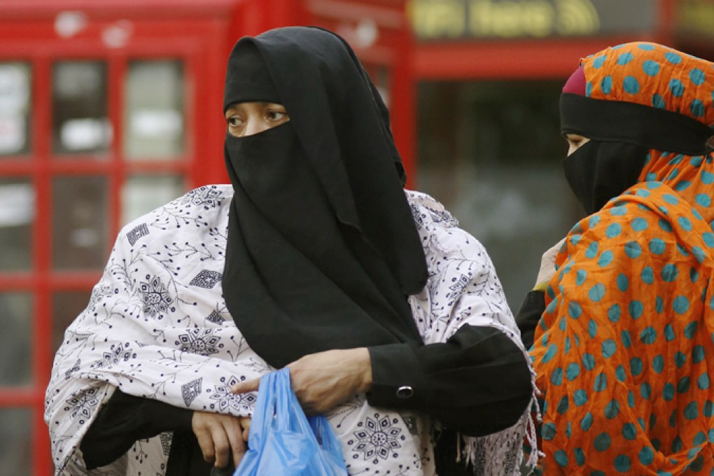 British leaders reluctantly join debate about wearing of full-face veils