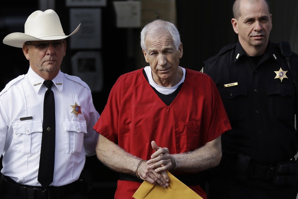 former Penn State University assistant football coach Jerry Sandusky (centre). Photo: AP