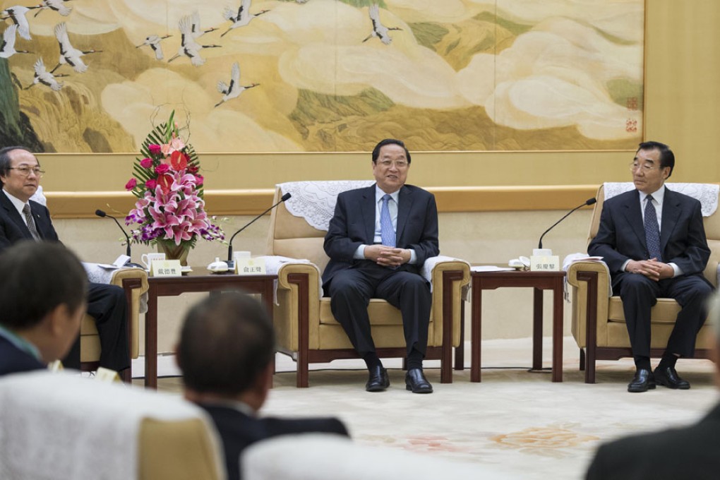 Yu Zhengsheng (centre) meets with a delegation of the Friends of Hong Kong Association in Beijing. Photo: XInhua