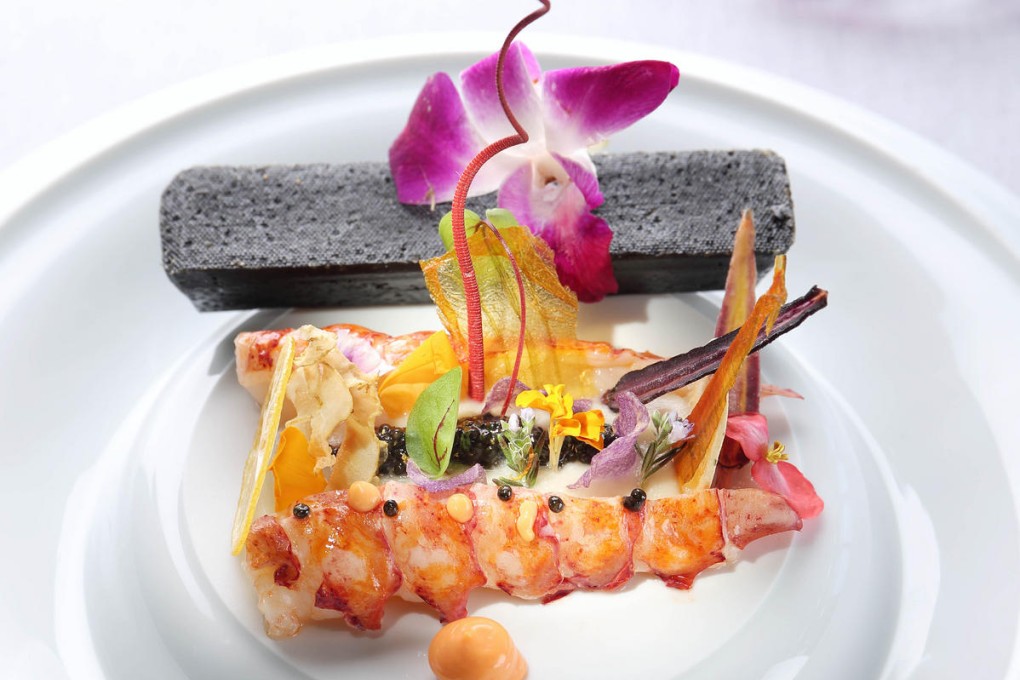 Poached lobster tail with chervil root purée, baby salad leaves and Royal Oscietra caviar sauce from Tosca restaurant at the Ritz-Carlton