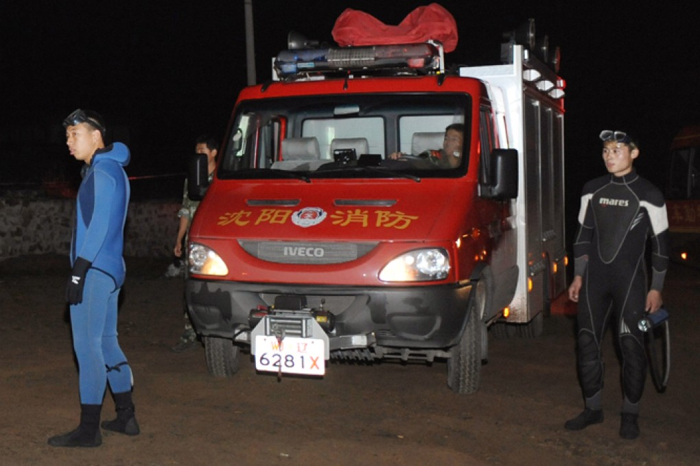 Rescuers searching for missing US pilot David Riggs have found his body in Lake Caihu. Photo: Xinhua