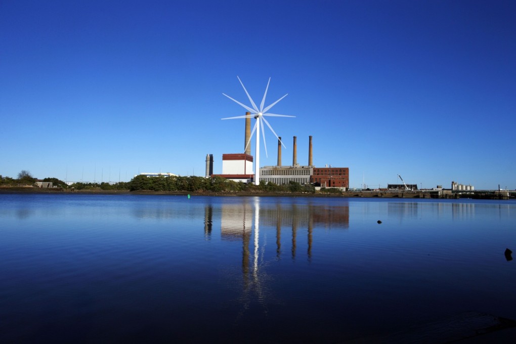 A  Massachusetts Water Resources Authority wind turbine in front of a 1951 megawatt fossil fuel power plant in Charlestown. The upcoming UN report on climate change is not likely to upset US deniers of global warming. Photo: Reuters