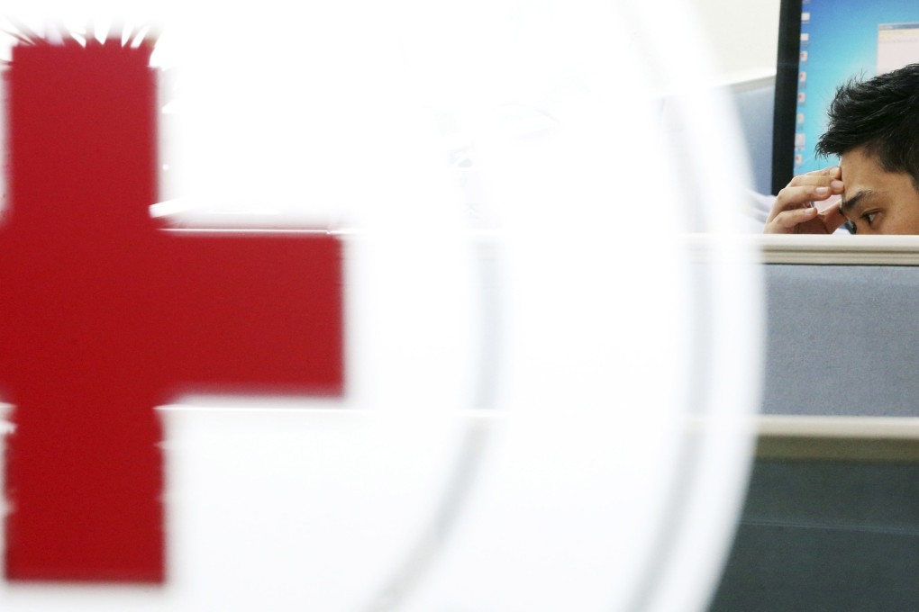 An employee of the South Korean Red Cross, which organizes inter-Korean family reunions, talks on the phone at the Red Cross office in Seoul. Photo: Reuters