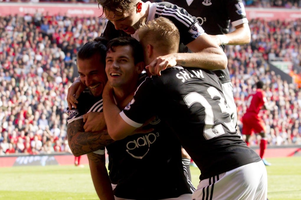 Saints' Dejan Lovren (centre) celebrates his goal. Photo: AP