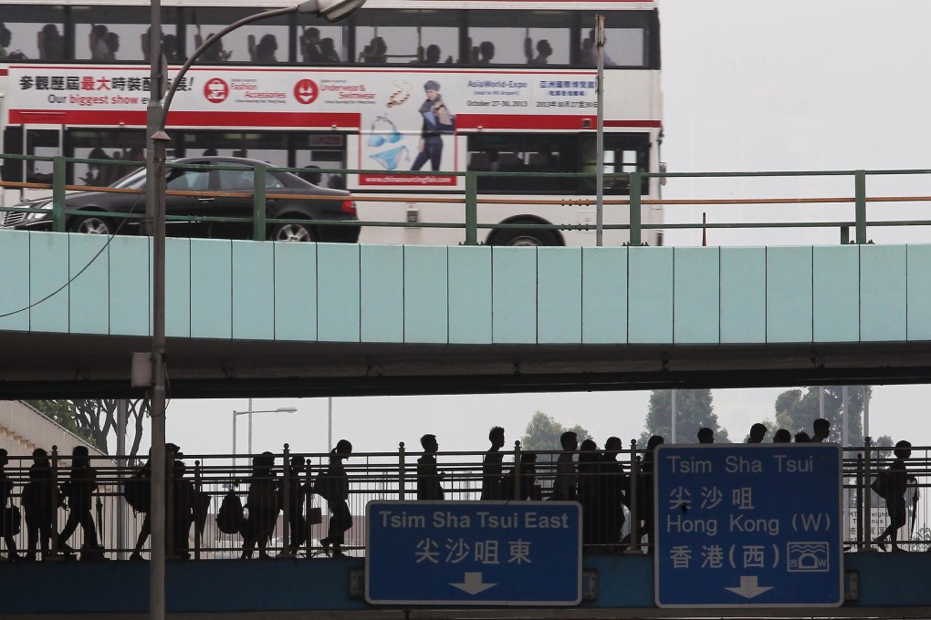 People in Hung Hom begin their commute to work after the typhoon signal is lowered. Photo: Sam Tsang
