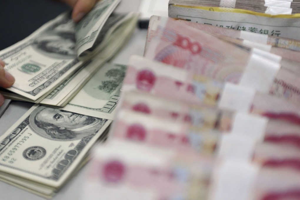 The yuan is expected to appreciate 5 per cent against the US dollar by 2015. Photo: Reuters
