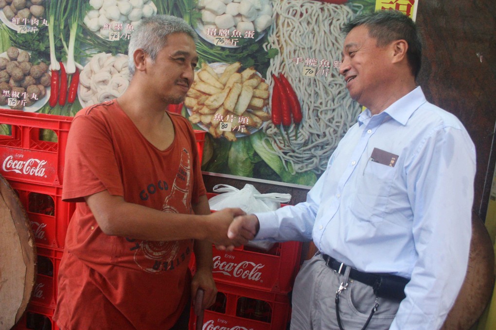 Danny, a homeless man, and Chau Shu-tak, right. Photo: Annemarie Evans