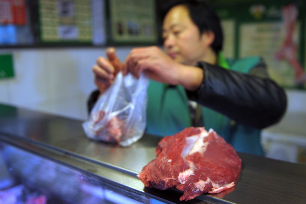 A vendor sells beef in a market in Shanghai. Photo: Shanghai