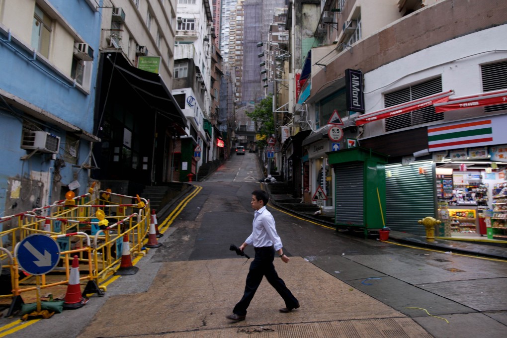 A man walks on an empty street in the Soho district of Hong Kong. Photo: AFP
