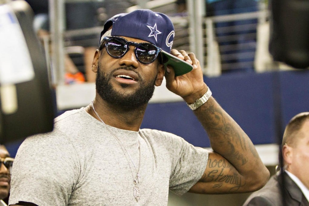 LeBron "King" James relaxes at an NFL match. Photo: AFP