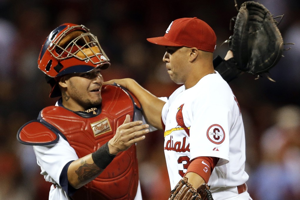 St. Louis Cardinals' Yadier Molina, left, and Carlos Beltran celebrate following the Cardinals' 4-3 victory over the Washington Nationals. Photo: AP