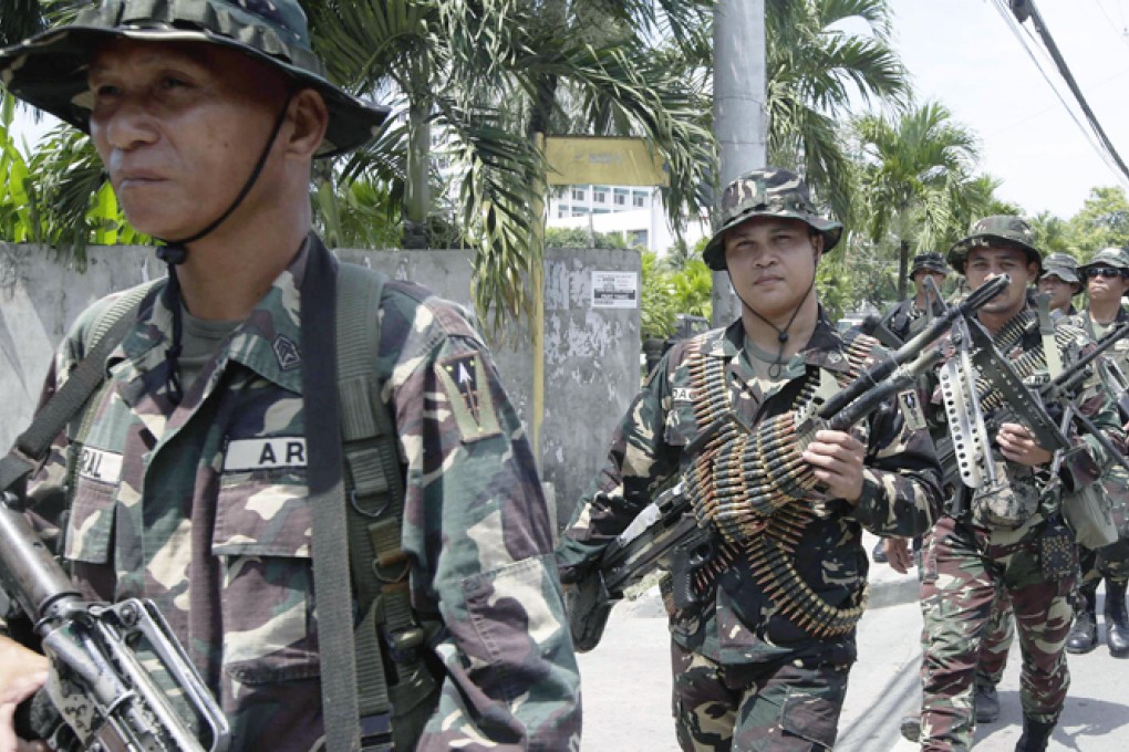 Troops in Zamboanga, scene of an earlier rebel attack. Photo: AP