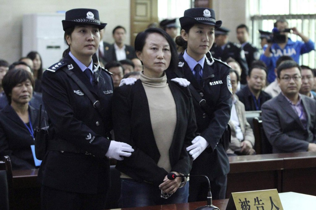 Gong Aiai, ex-deputy head of the Shenmu Rural Commercial Bank, listens during her one-day trial yesterday. Photo: Reuters