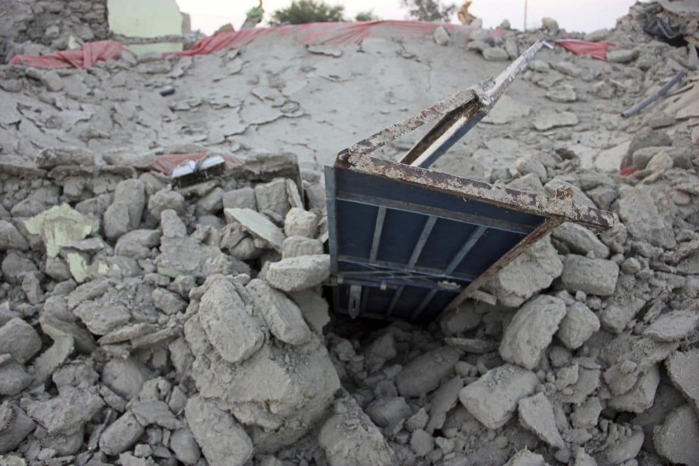 A pile of rubble is all that is left of a house in the town of Awaran, capital of the worst-hit district of the same name. Thousands of homes were destroyed. Photo: Reuters