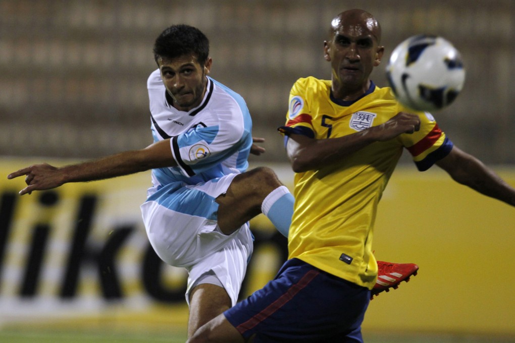 Ibrahim Zawahreh of Al Faisaly blasts the ball past Kitchee's Zesh Rehman during their AFC Cup second leg in in Amman. Photo: Reuters