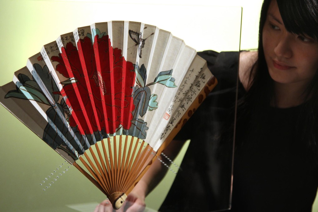 A painted fan signed by artist Yu Feian (1889-1959) is on display during an auction preview at Sotheby’s in Pacific Place, Admiralty, in 2010. Photos: AFP; Sam Tsang