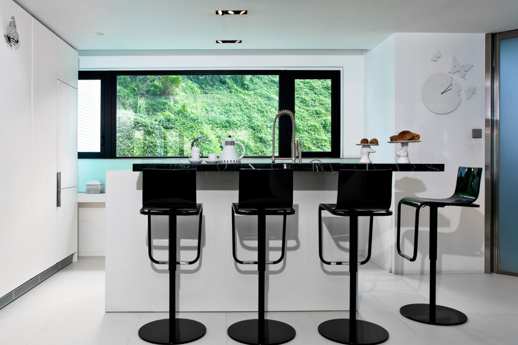 Kitchen: The open kitchen houses an oven behind the bar and, along the windows, a workbench for Ma’s two daughters. The stools were HK$9,000 each at Ligne Roset (16 Blue Pool Road, Happy Valley, tel: 2891 0913). The gooseneck tap (HK$29,200) came from colourliving (333 Lockhart Road, Wan Chai, tel: 2510 2666) and the butterfly on the cabinet cost HK$1,200 at Galerie Huit (8 St Francis Street, Wan Chai, tel: 2520 0281).