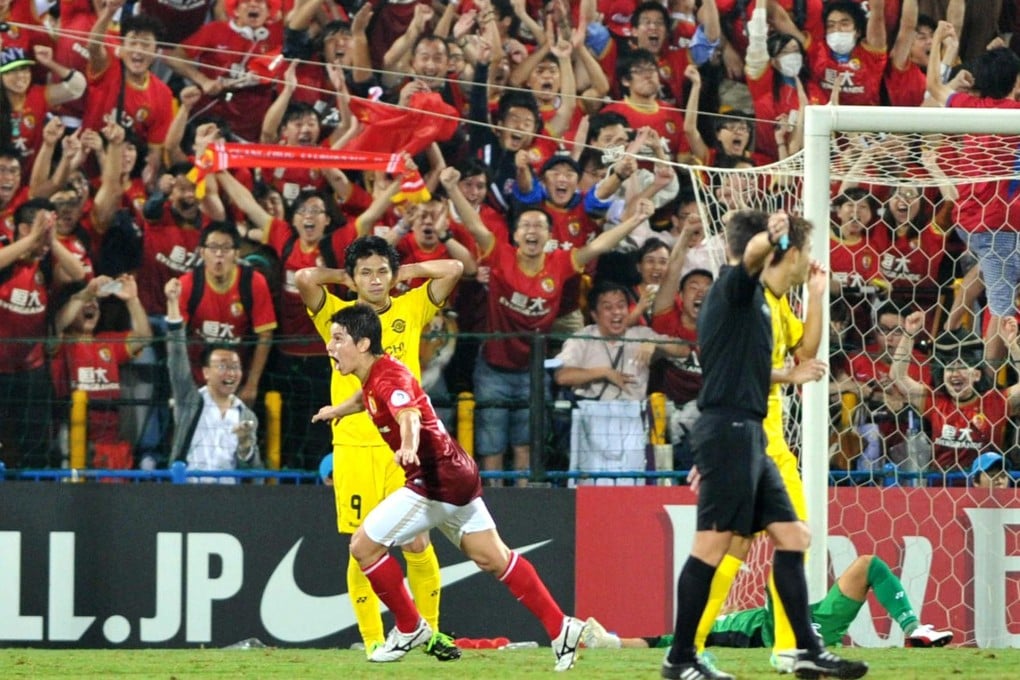 Guangzhou Evergrande midfielder Dario Conca celebrates after smashing home a goal in the 4-1 win over Japan's Kashiwa Reysol in Kashiwa last night. Photo: AFP