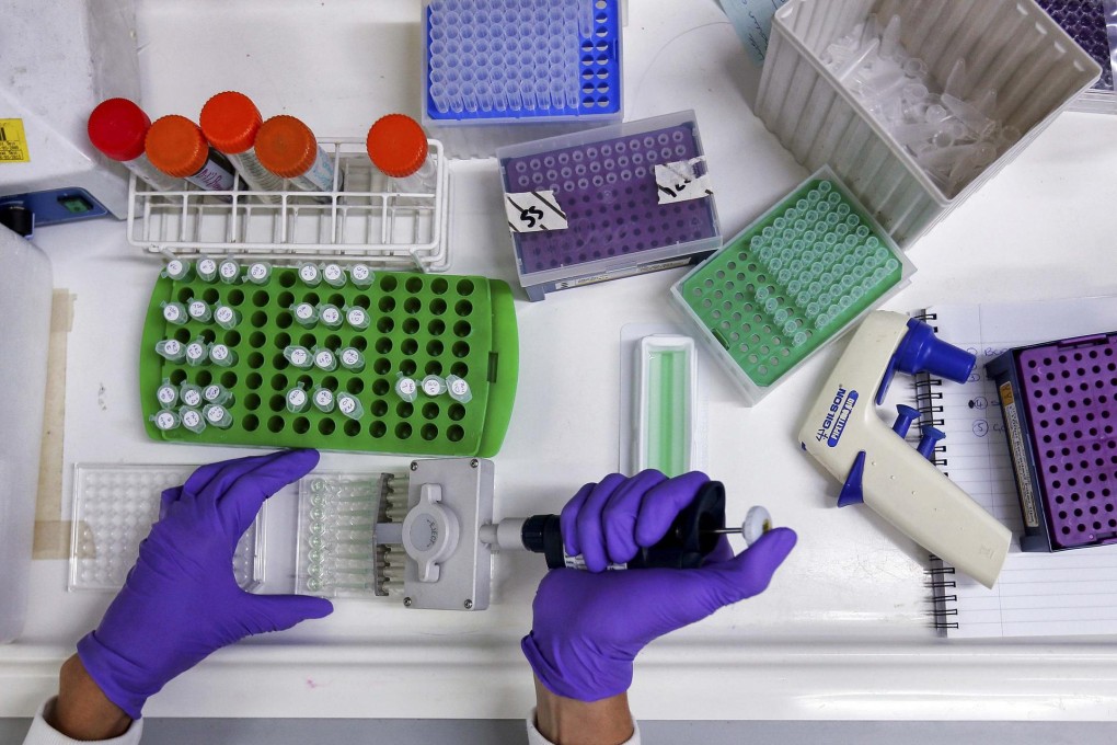 A scientist prepares protein samples for analysis. Molecular similarities in tumours could herald pan-cancer treatments. Photo: Reuters