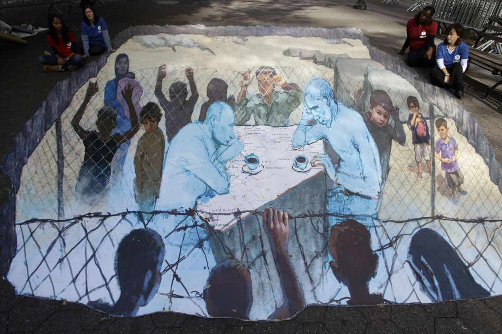 Art on display at the UN shows Russian President Vladimir Putin and US President Barack Obama sitting over a map of Syria. Photo: Reuters