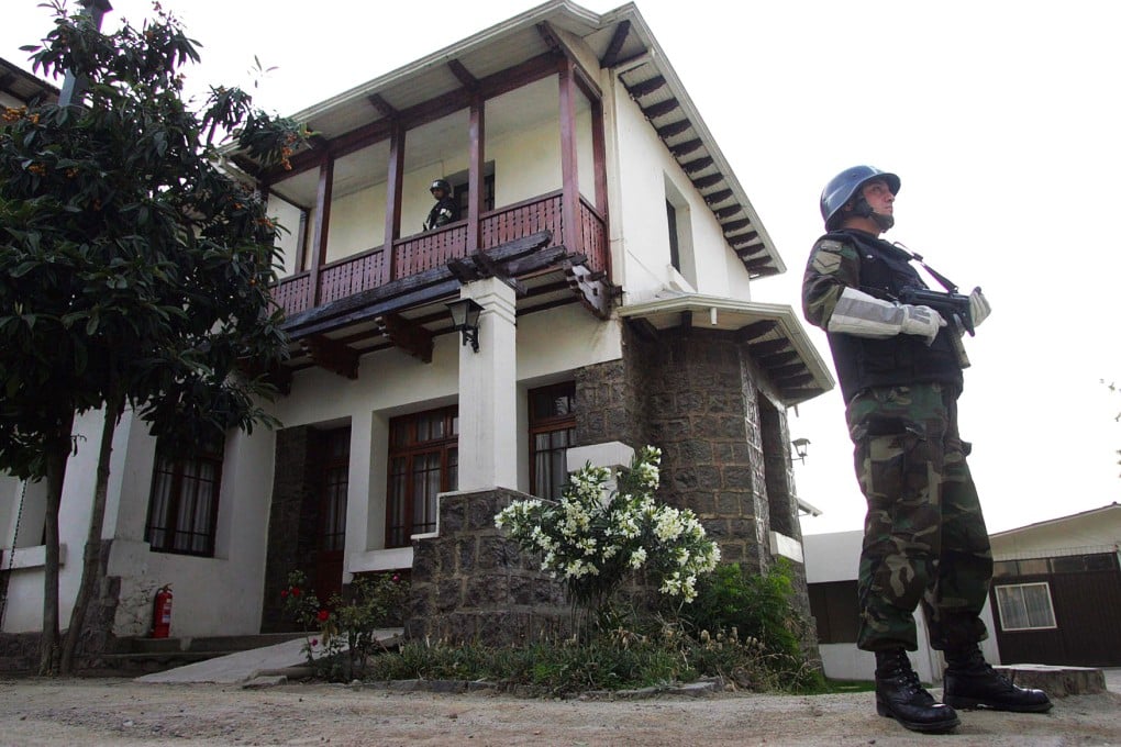 A guard outside a private cabin at Cordillera prison. Photo: EPA
