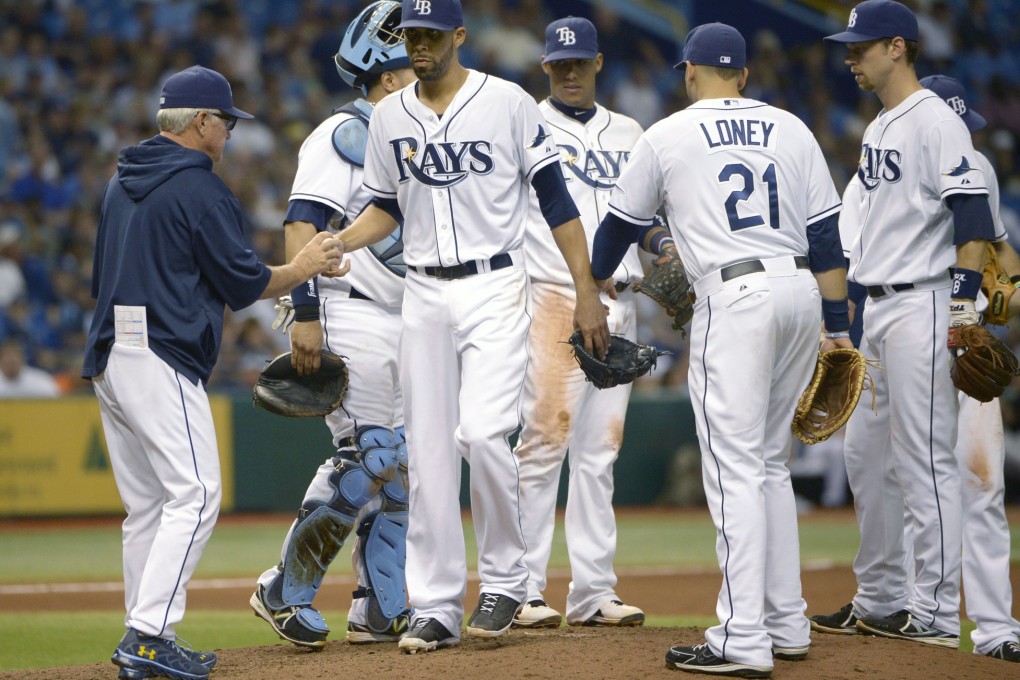 Manager Joe Maddon praises Tampa Bay Rays players for achieving 90 regular-season wins for the fourth year in a row. Photo: AP