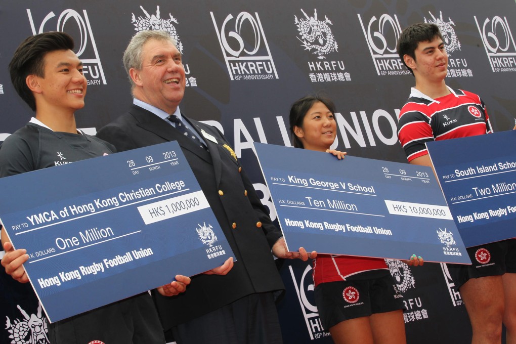 HKRFU chairman Trevor Gregory presents cheques. Photo: K.Y. Cheng